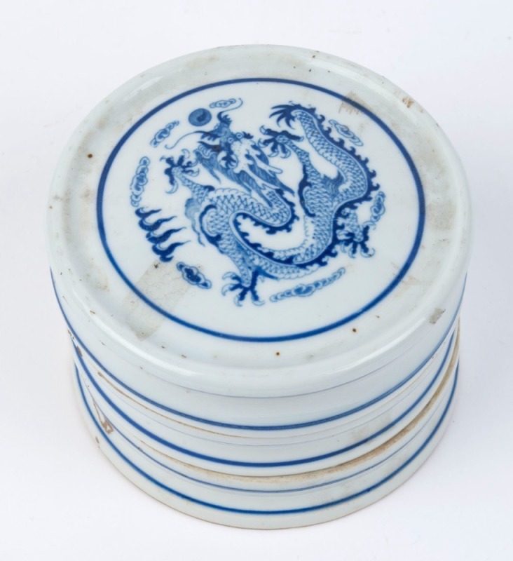 A Chinese three sectional blue and white porcelain paste jar with dragon decoration, underglaze blue four character Qianlong mark, ​7cm high, 11cm diameter