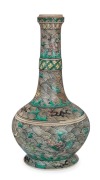 A famille verte Chinese porcelain bottle vase decorated with winged dragons, horses and mythical animals amongst stormy waves, Kangxi period, underglaze blue six character early Kangxi mark. Compare: "SERIES FOR FOLK COLLECTION OF PORCELAIN {No1} KANGXI.