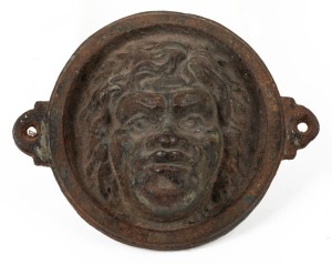 Aboriginal face cast iron architectural roundel, 19th century, ​​​​​​​16cm wide