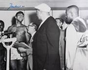 MUHAMMAD ALI, signed b/w photograph of Ali at weigh-in with Sonny Liston, size 51x41cm. With CoA sticker No.0600.