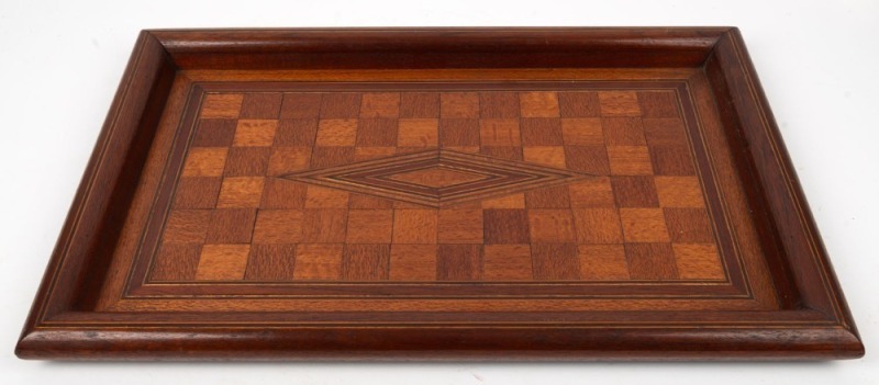 An Australian checkerboard top marquetry serving tray, timbers include silky oak, grevillea, cedar, rainforest walnut, maple and others, Queensland origin, early 20th century, ​​​​​​​55cm wide