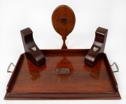 A fiddleback blackwood hand-mirror, pair of blackwood bookends adorned with silver map of Tasmania and a serving tray with silver plaque inscribed "Burnie Tennis Club, With All The Best Wishes From Members, 28th of April, 1945", 20th century, the tray 56c