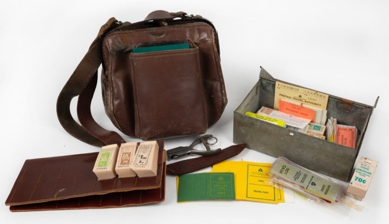 MELBOURNE TRANSIT AUTHORITY: A conductor's leather-strapped shoulder bag, ticket clicker (E127), leather ticket holder (V102) which still has full (or near full) pads of tickets to V.F.L. PARK; a quantity of other tickets, concession cards, instruction ca