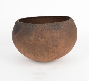 An earthenware cooking bowl with incised decoration, Papua New Guinea origin, 21cm high