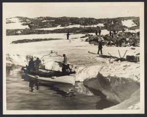 THE B.A.N.Z. ANTARCTIC EXPEDITION: Official original photograph by Captain Frank Hurley: Image B32 - Title: Mawson Revisits Former Winter Quarters, with official "MAWSON ANTARCTIC EXPEDITION" handstamp and release date "TUESDAY JUN. 2, 1931" verso, togeth