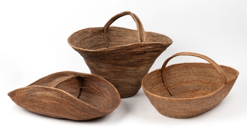 Three woven carrier baskets with handles, natural fibre, Papua New Guinea origin, ​​​​​​​the largest 40cm high