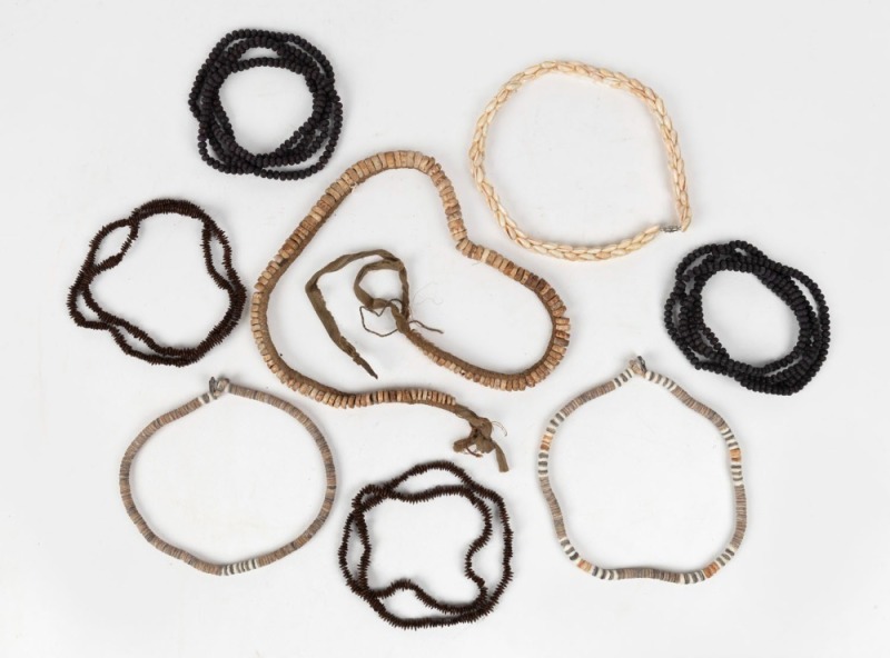 Eight assorted tribal necklaces including shell money, seed pod and kauri shell, ​​​​​​​the largest 95cm long