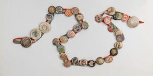 WW1 period collection of 34 NURSING badges affixed to a silk tri-colour bunting ribbon