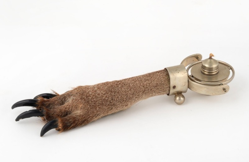 A table cigar lighter with kangaroo foot handle and gimbal mechanism, 31cm long