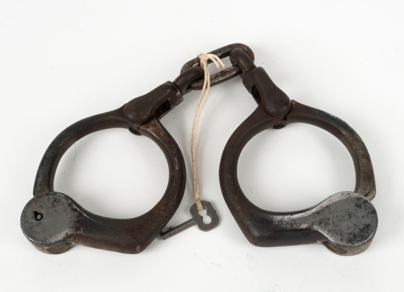 TOWER BEAN American push-button handcuffs with remains of original nickel plated finish, ​​​​​​​25cm wide