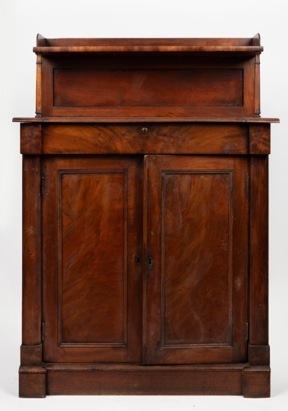 An antique Australian cedar chiffonier with recessed paneled shelf back, thumbnail moulded edge and single drawer above two panelled doors, Tasmanian origin, circa 1840, Note: The edges have been trimmed to fit a recess alcove. 124cm high, 87cm wide, 52cm