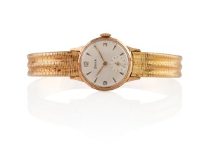 DOXA lady's vintage wristwatch in 14ct gold case with 14ct gold bracelet, manual movement with baton numerals and subsidiary dial, 31 grams without movement