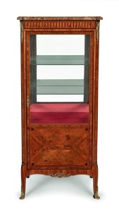 An antique French vitrine, veneered with tulipwood and chevron banding with floral marquetry panels, adorned with ram's head ormolu mounts and rouge scaglioli marble top, circa 1870, 147cm high, 62cm wide, 34cm deep.