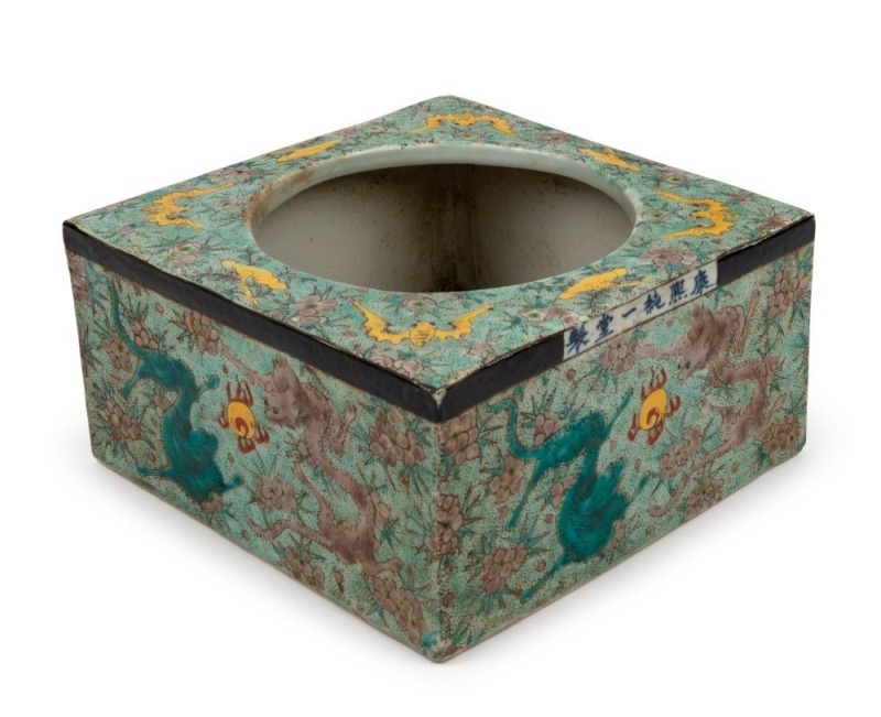 An antique Chinese famille vert porcelain square form jardiniere with bats and dragon chasing a flaming pearl, Kangxi period and mark, ​​​​​​​9cm high, 18cm wide