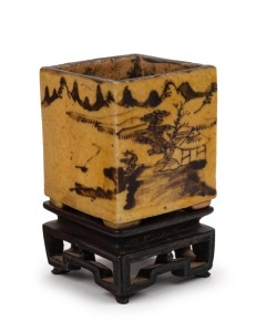 An antique Chinese porcelain square form brush pot on original carved wooden stand, Qing Dynasty, 18th/19th century, ​​​​​​​9cm high overall