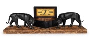 A fine French Art Deco mantle clock with bronze panther statue decoration on marble base with time only movement and Roman numerals, circa 1930, 18cm high, 57cm wide