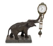Elephant mystery swinging clock, cast metal and marble, early 20th century, 27cm high
