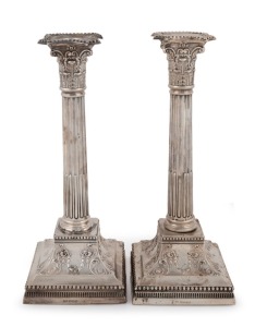 A pair of English sterling silver Corinthian column candle sticks by James Dixon & Sons of Sheffield, circa weighted bases, 28cm high