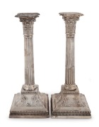 A pair of English sterling silver Corinthian column candle sticks by James Dixon & Sons of Sheffield, circa ​​​​​​​weighted bases, 28cm high