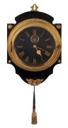 An antique French wall clock with tassel wind movement, exposed lever escapement, black dial and Roman numerals, 19th century, ​​​​​​​35cm high overall