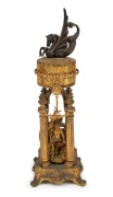 An antique French ormolu cased annular dial pillar clock depicting Neptune, 19th century, 38cm high