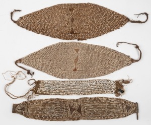 Four tribal headdresses, shell, fibre and cloth, Papua New Guinea origin, the largest 50cm wide