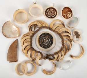 Assorted Kina shell money rings, pearl shell adornments, kauri shell amulet, boar tusk chest adornment etc., Papua New Guinea origin, (14 items)