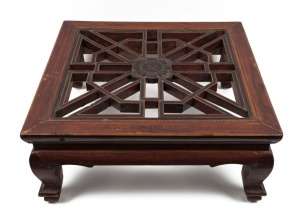 An antique Chinese elm timber foot stool with carved lattice work top and floral motif, Qing Dynasty, circa 1870, 22cm high, 53cm wide, 53cm deep