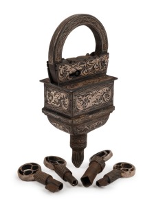 An impressive antique Indian puzzle padlock with four keys finished in silver bidri ware, 19th century, 15cm high