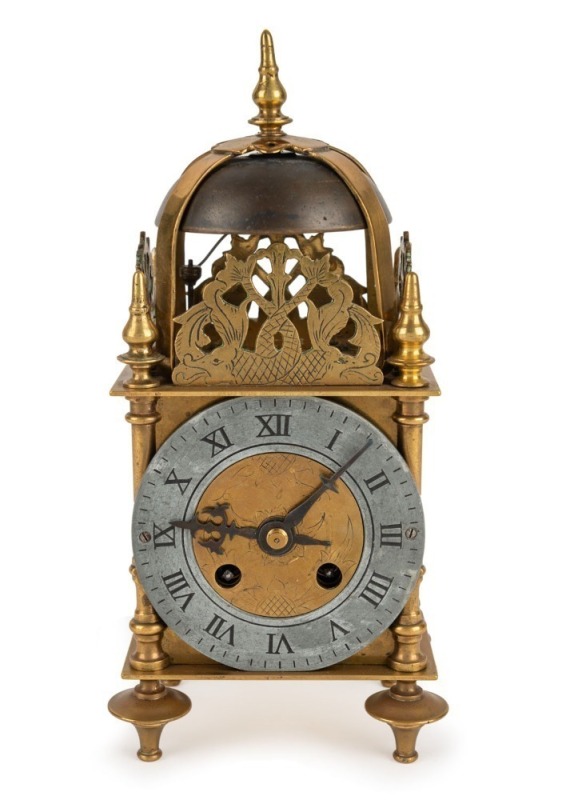 An antique French lantern clock in brass case with pewter dial and Roman numerals, 19th century, 22cm high