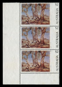 1974 (SG.566a) $2 "Red Gums of the Far North" lower-left corner vertical strip of 3, all units with error "Partial omission of black colour, affecting the 'HANS HEYSEN 1877-1968' inscription", the main black inscription also weaker than normal, MUH, BW.665cb (variant).