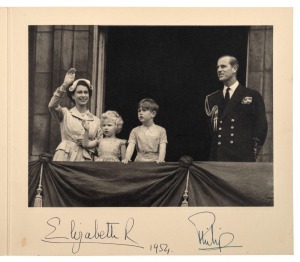 ELIZABETH II: Christmas Card for 1954 signed by The Queen and Prince Philip. The signatures appear in blue ink, below a black and white photograph of the royal family, including Prince Charles and Princess Anne on the balcony of Buckingham Palace. 18 x 20