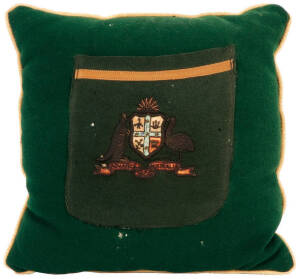 BILL WOODFULL'S BLAZER POCKET, from the 1926 Ashes Tour, green wool, yellow silk trim, wire-embroidered Coat-of-Arms & "1926", made into a small cushion with other parts of the blazer. Few moth-holes, otherwise good condition.