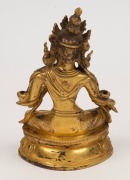 An antique Tibetan gilt bronze green tara figure, wearing a finely cast five-pronged crown, earrings and necklaces, with down cast eyes in serene expression, 19th century, the base marked with an engraved Tibetan thunder bolt. ​​​​​​​16cm high - 3