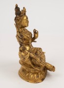 An antique Tibetan gilt bronze green tara figure, wearing a finely cast five-pronged crown, earrings and necklaces, with down cast eyes in serene expression, 19th century, the base marked with an engraved Tibetan thunder bolt. ​​​​​​​16cm high - 4