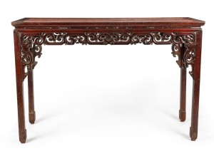 An antique Chinese carved timber alter table with bird decoration, Qing Dynasty, 18th/19th century, note: later stone top. 124cm high, 185cm wide, 60cm deep