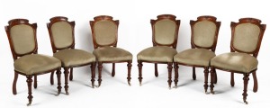 A fine set of six antique English carved walnut dining chairs with green velvet upholstery, circa 1865,