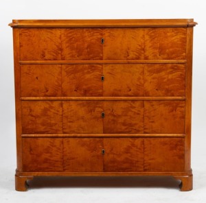 An antique Biedermeier chest of four drawers veneered in well figured satin birch with cushion mouldings and bracket feet, circa 1845, 106cm high, 115cm wide, 52cm deep