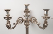 A stunning pair of Elkington antique English silver-plated candelabra with griffin decoration, together with mirrored silver-plated stands, also by Elkington, 19th century (four items). PROVENANCE: Ex Myers boardroom, Melbourne, 75cm high each overall&nbsp; - 2