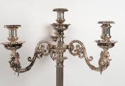 A stunning pair of Elkington antique English silver-plated candelabra with griffin decoration, together with mirrored silver-plated stands, also by Elkington, 19th century (four items). PROVENANCE: Ex Myers boardroom, Melbourne, 75cm high each overall&nbsp; - 3