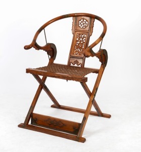 A Chinese horseshoe back chair, pierced and carved design with brass fittings and woven seat, 20th century, 109cm high