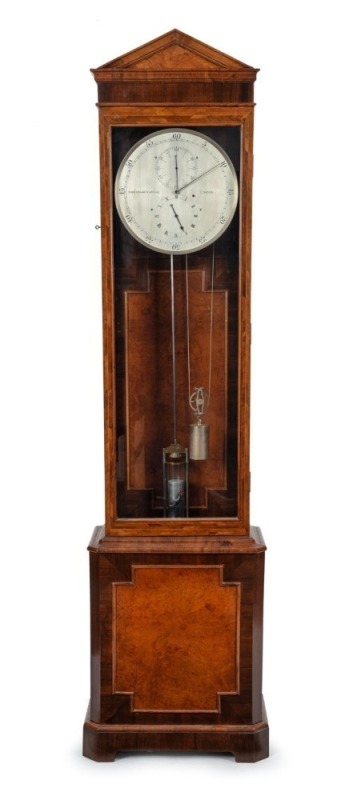 A fine quality antique English regulator with Graham's deadbeat escapement, jewelled pallets, maintaining power, trapezoidal beat adjustment to the crutch, and pivot capped screw adjustment to the back plate. Silvered dial with standard regulator dial lay