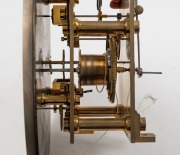 A fine quality antique English regulator with Graham's deadbeat escapement, jewelled pallets, maintaining power, trapezoidal beat adjustment to the crutch, and pivot capped screw adjustment to the back plate. Silvered dial with standard regulator dial lay - 4