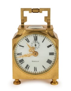 TIFFANY & Co. antique French "Pendule d'Officer" brass cased travelling clock with time only movement and bell striking alarm, one piece white enamel dial, gilt pierced hands with alarm subsidiary below "12", circa 1900, 14cm high