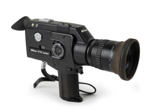 NIPPON KOGAKU: Circa 1973 Nikon R10 Super 8mm movie camera [#792850] with Cine-Nikkor Zoom&middot;C Macro 7-70mm f1.4 lens, UV lens filter, rubber lens hood, rubber eyepiece, and wrist strap. Note: Missing battery holder insert.