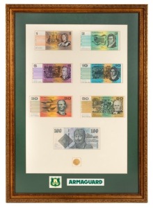 A framed presentation created for ARMAGUARD featuring $1, $2, $5, $10, $20, $50 and $100 paper banknotes together with a $200 gold Koala.