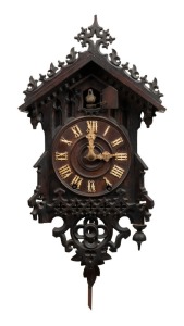 An antique Black Forest cuckoo wall clock with original wooden framed spring driven movement in carved timber case, 19th century, with hand-written dedication affixed to reverse dated 1892. Note: finely carved original bone hands. 54cm high overall includ