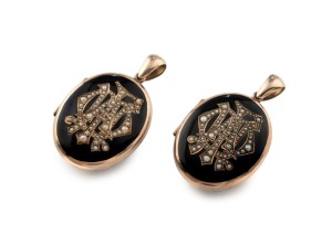 A rare pair of antique 9ct gold mourning lockets, both adorned with seed pearl monograms surrounded in black enamel, both hinged with double photo windows, circa 1870, each 5cm high overall, 31.7 grams total including glass