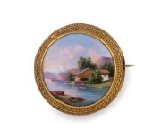 An antique Swiss 18ct yellow gold circular brooch with enamel lake scene landscape mounted in Etruscan wire work border, 19th century, ​​​​​​​3cm diameter, 5.2 grams total