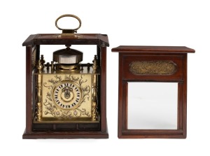 MAKURA DOKEI rare antique Japanese travelling spring table clock in fine shitan-wood case adorned with exceptional gilt metal fittings, chain fusee driven time train, going barrel bell striking with verge escapement and balance wheel, circa 1840, 18cm high overall. PROVENANCE: Purchased from Gerald E. Marsh of Winchester, U.K. December 2011. Previously: The John Read Collection of Fine Antique Japanese Timekeepers, Bonhams, 11th May, 2010.